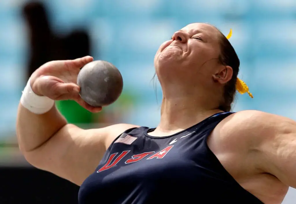 A shot put can be a sport for fat people, like this woman, who is ready to throw the weighted metal ball in an Olympics competition.