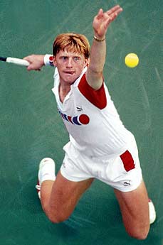 Tennis player Boris Becker making a serve.