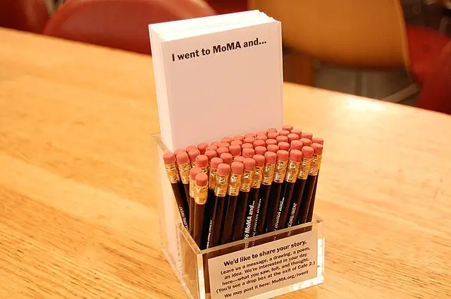 Pencils and papers with the words written, "I went to MoMA and..."