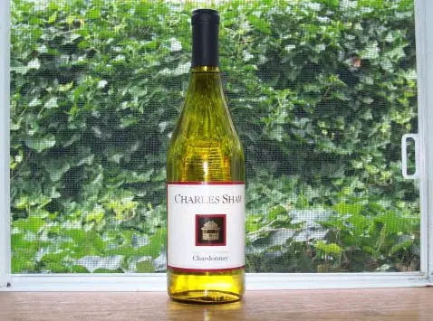Charles Shaw bottle of Chardonnay is displayed near the window.