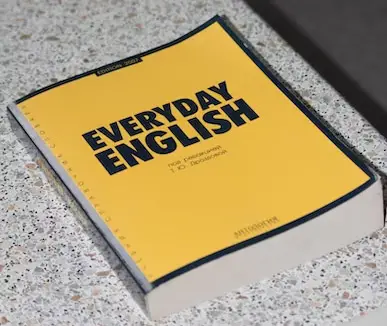 A book with yellow cover titled Everyday English