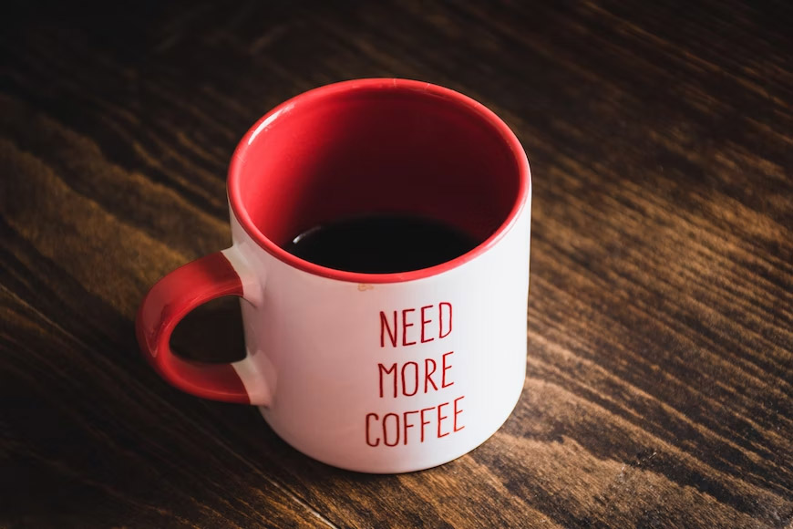 A cup of coffee with a label "Need More Coffee".