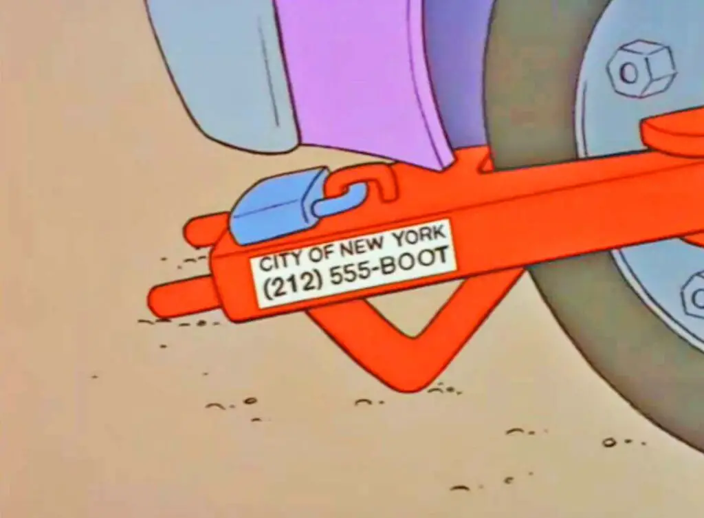 Homer's car is clamped that shows the phone numbers of the City of New York as (212) 555-BOOT.