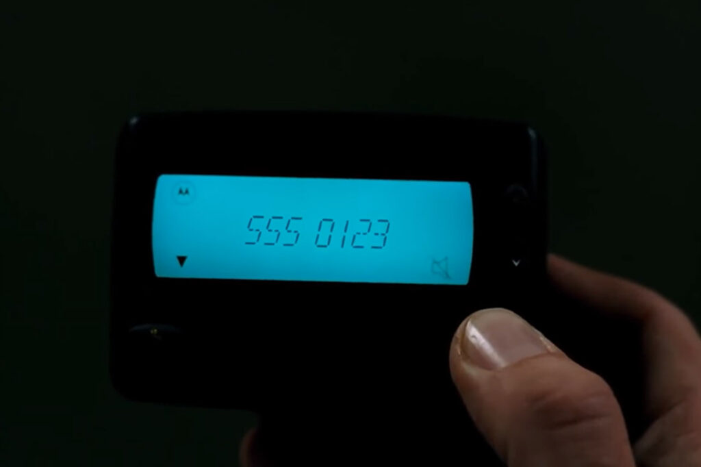 A number on the pager as God calls Bruce in it.