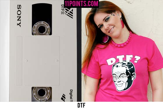 An old Sony tape and a woman wearing a pink shirt with the sexual acronym DTF.