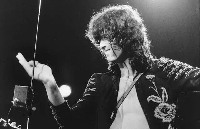 Jimmy Page performing a theremin musical instrument.