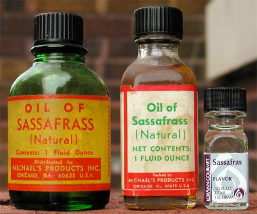 3 bottles Sassafras oil in different sizes.