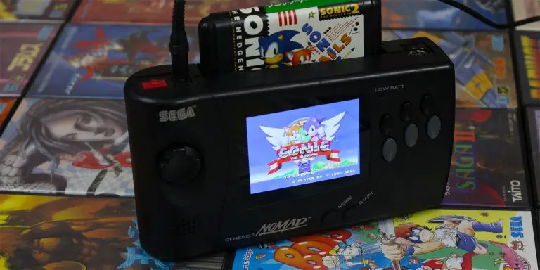Sega video game console showing Sonic the Hedgehog on screen. It's one of those brands that don't translate well in other languages.
