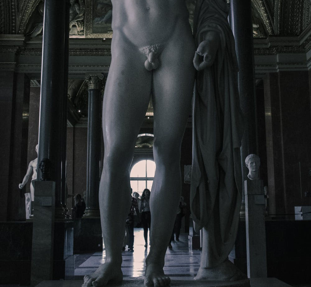 A naked statue in a public museum showing his genitals.