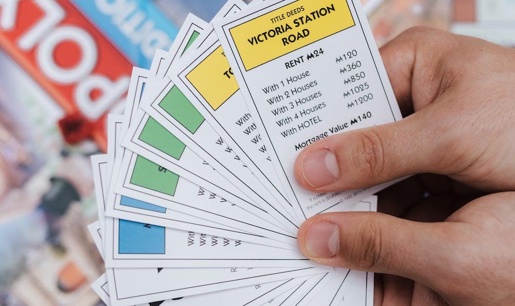Holding deal cards and trading them is one of the best monopoly strategies.