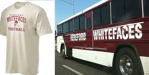 A white t-shirt printed with the words, "Hereford Whitefaces Football," and a bus with the name, "Hereford Whitefaces."