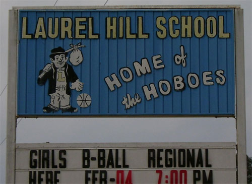 "Laurel Hill School home of the Hoboes" billboard with a game schedule below.