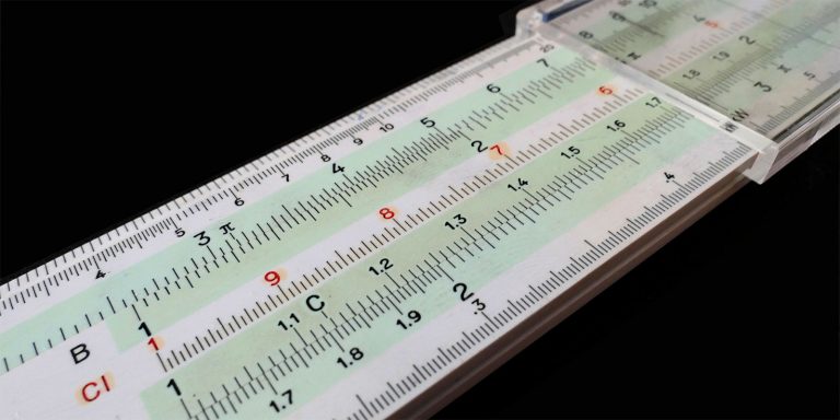 A slide ruler showing different measurements.