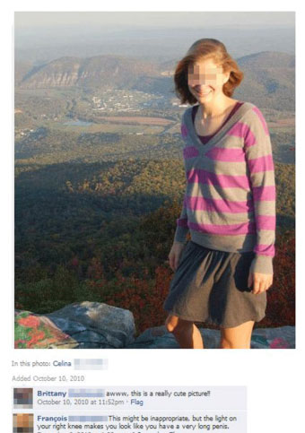 A woman poses on top of a mountain when the light on her knee makes her look like having a very huge penis.