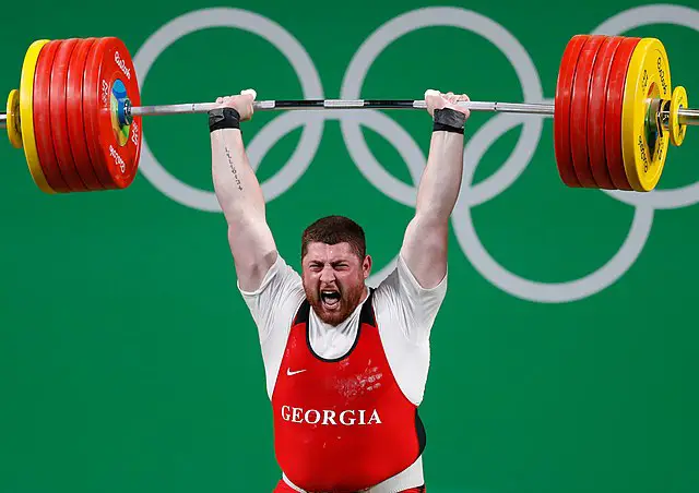 A Georgian contender showing lots of emotions while weightlifting.