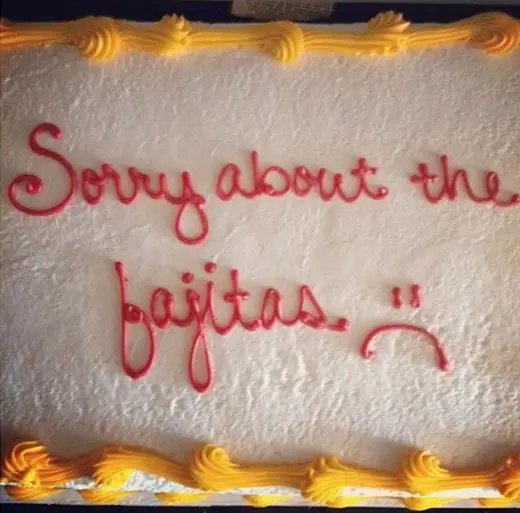 An apology cake with the message. "Sorry about the fajitas. :("