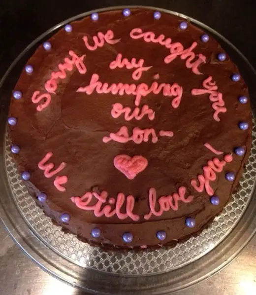 Another awkward sorry cake with the message, "Sorry we caught you dry humping our son -- We still love you!"