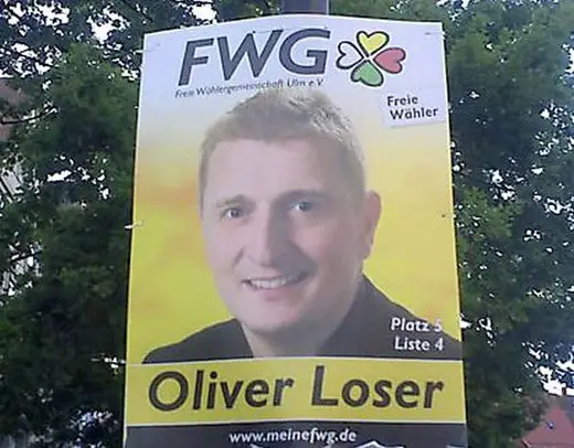 A poster of Oliver Loser with his picture erected on a street post.