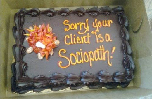 An apology cake with the message, "Sorry Your Client is a Sociopath!"