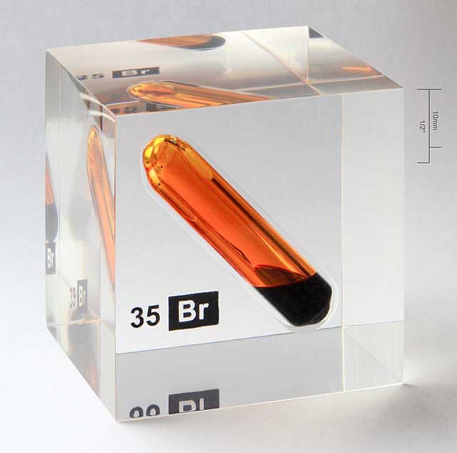 Bromine vial in a perspex or acrylic cube.