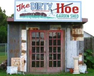 A garden shed with the business name, The Dirty Hoe.