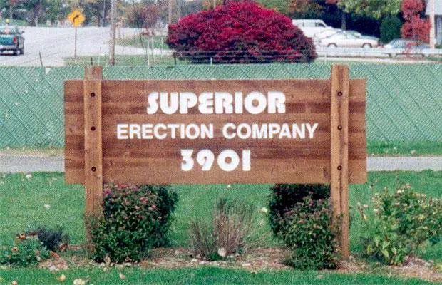 A wooden signage in the park made by Superior Erection Company.