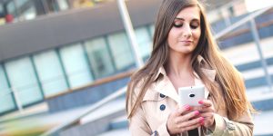 A woman texting on her phone.