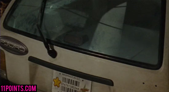 Back view of a white car with the brand "Fjord" in Idiocracy.