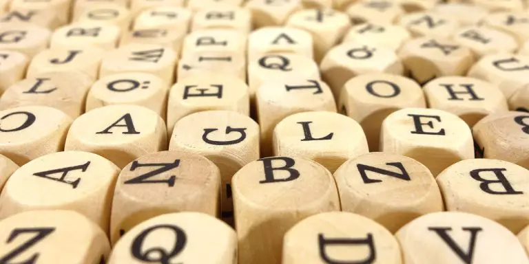 Scrabble tile cubes with different letters.