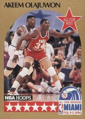 Akeem Olajuwon playing on the court as featured in this NBA hoops card.