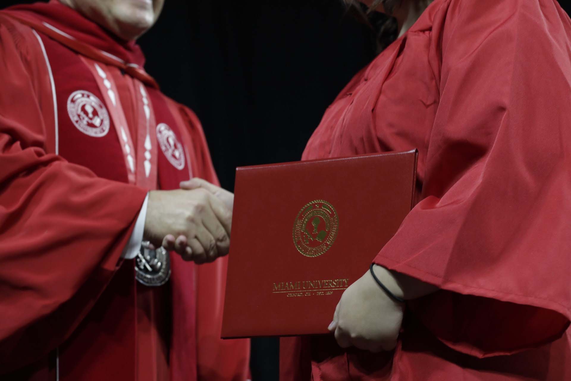 Handshaking during graduation ceremony in Miami University.